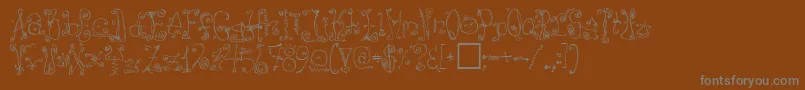 フォントDanzin – 茶色の背景に灰色の文字