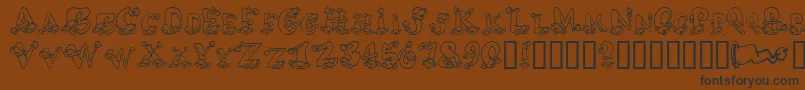 AlphaElfin Font – Black Fonts on Brown Background