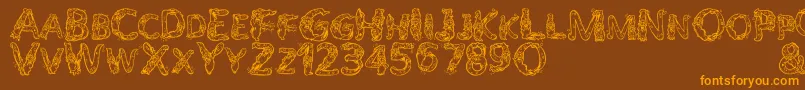 AlphaWizard-Schriftart – Orangefarbene Schriften auf braunem Hintergrund