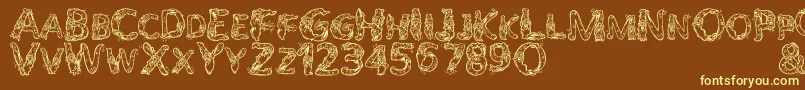 AlphaWizard Font – Yellow Fonts on Brown Background