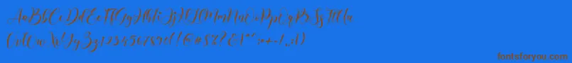 フォントAlyanda – 茶色の文字が青い背景にあります。