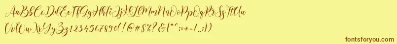 Alyanda-Schriftart – Braune Schriften auf gelbem Hintergrund