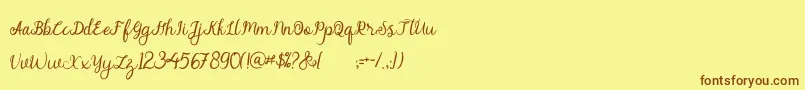 alymhela Font – Brown Fonts on Yellow Background