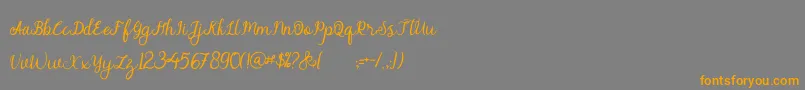 alymhela Font – Orange Fonts on Gray Background