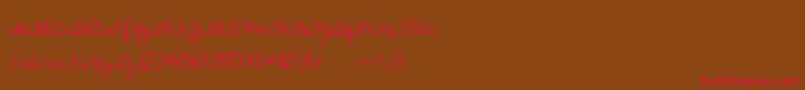 フォントalymhela – 赤い文字が茶色の背景にあります。