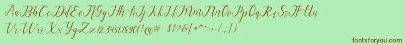 alysa scrip-Schriftart – Braune Schriften auf grünem Hintergrund