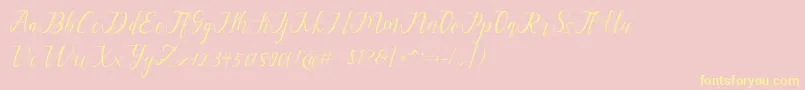 Fonte alysa scrip – fontes amarelas em um fundo rosa