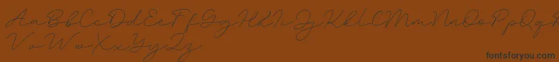 Amalina-Schriftart – Schwarze Schriften auf braunem Hintergrund