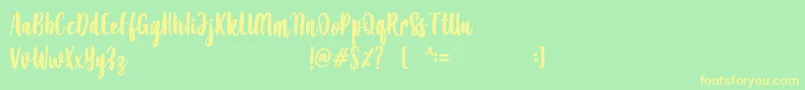 フォントAmanise – 黄色の文字が緑の背景にあります