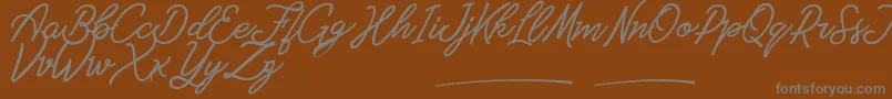 Czcionka Amarula Personal Use – szare czcionki na brązowym tle