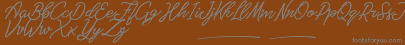 Amarula Personal Use-Schriftart – Graue Schriften auf braunem Hintergrund