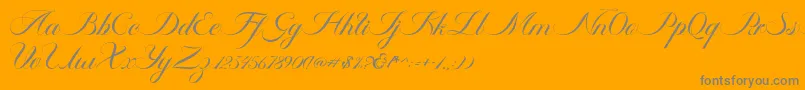 Ambergris Script Free Personal-fontti – harmaat kirjasimet oranssilla taustalla