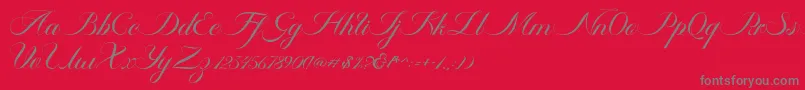 Fonte Ambergris Script Free Personal – fontes cinzas em um fundo vermelho