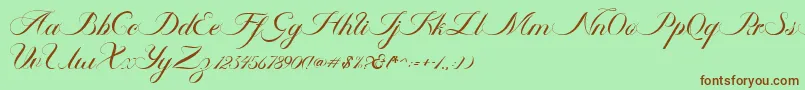 Ambergris Script Free Personal-fontti – ruskeat fontit vihreällä taustalla