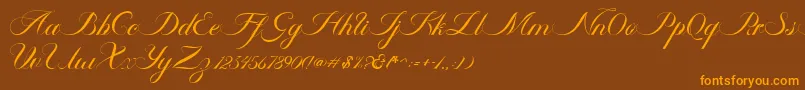 フォントAmbergris Script Free Personal – オレンジ色の文字が茶色の背景にあります。