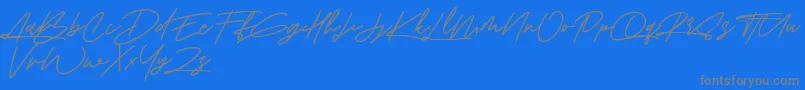 Amberla Free-fontti – harmaat kirjasimet sinisellä taustalla