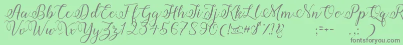 Amberlyn Font – Gray Fonts on Green Background