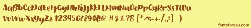 Amel Brush Font Font – Brown Fonts on Yellow Background
