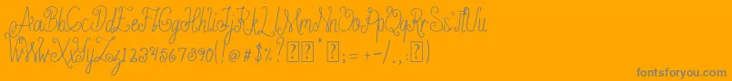 Fonte Ameliana free – fontes cinzas em um fundo laranja