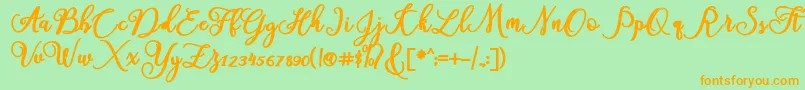 フォントAmerica – オレンジの文字が緑の背景にあります。