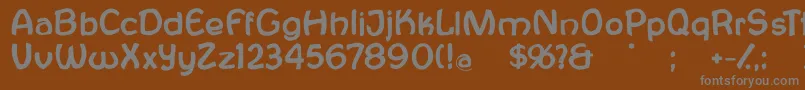 Antroposofia-fontti – harmaat kirjasimet ruskealla taustalla