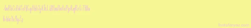 Amindinah Font – Pink Fonts on Yellow Background