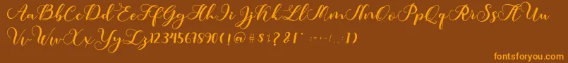 フォントAmotim – オレンジ色の文字が茶色の背景にあります。