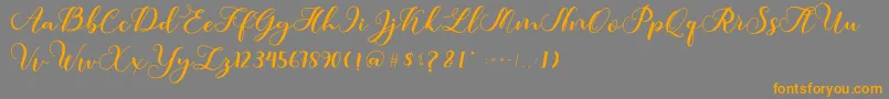 フォントAmotim – オレンジの文字は灰色の背景にあります。