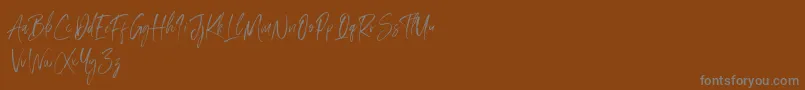Amourist Font – Gray Fonts on Brown Background