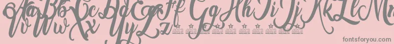 Amsterdam Personal Use-fontti – harmaat kirjasimet vaaleanpunaisella taustalla