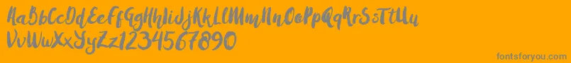 Amulhed brush   Demo-Schriftart – Graue Schriften auf orangefarbenem Hintergrund