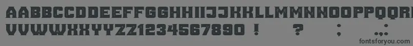 AnaGrunged Font – Black Fonts on Gray Background