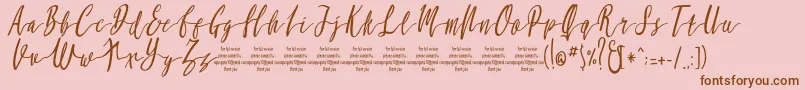 MollucaItalicFree-Schriftart – Braune Schriften auf rosa Hintergrund