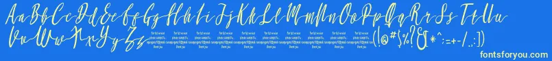 MollucaItalicFree-Schriftart – Gelbe Schriften auf blauem Hintergrund