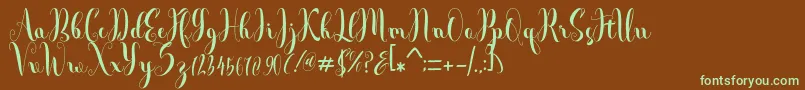 フォントAndalas – 緑色の文字が茶色の背景にあります。