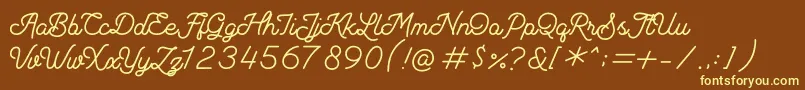 Fonte Andalusea Script PERSONAL USE – fontes amarelas em um fundo marrom