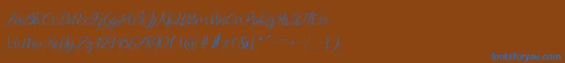 Andella Script-Schriftart – Blaue Schriften auf braunem Hintergrund
