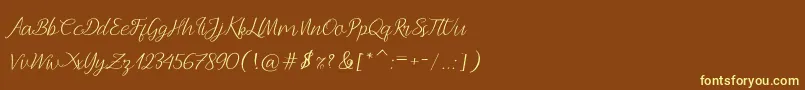 Andella Script-fontti – keltaiset fontit ruskealla taustalla