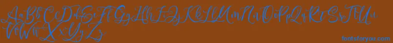 Czcionka Andriani Script – niebieskie czcionki na brązowym tle