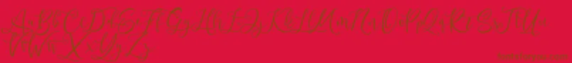 Fonte Andriani Script – fontes marrons em um fundo vermelho