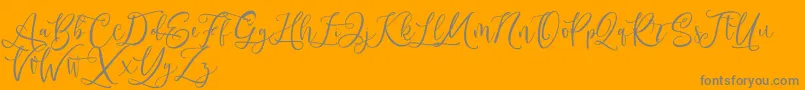 Andriani Script-Schriftart – Graue Schriften auf orangefarbenem Hintergrund