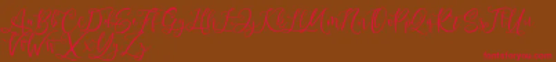 Fonte Andriani Script – fontes vermelhas em um fundo marrom