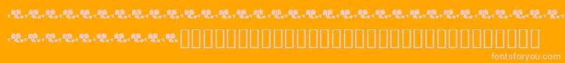 KrLotsOfHearts-Schriftart – Rosa Schriften auf orangefarbenem Hintergrund