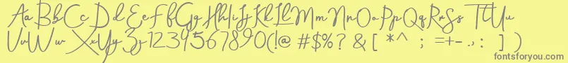 Aneisha demo-Schriftart – Graue Schriften auf gelbem Hintergrund