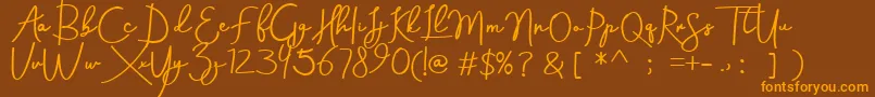 Aneisha demo-Schriftart – Orangefarbene Schriften auf braunem Hintergrund