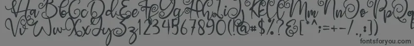 Angel Maleficent-Schriftart – Schwarze Schriften auf grauem Hintergrund