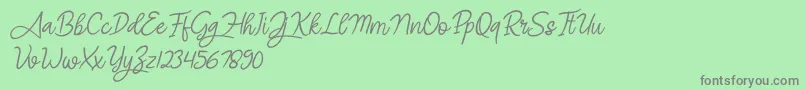 Fonte Angel Signature Italic – fontes cinzas em um fundo verde