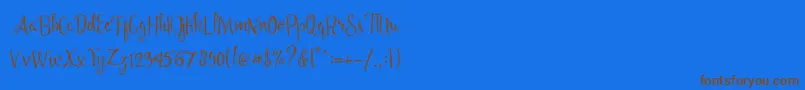 フォントAngelia Script Free Demo – 茶色の文字が青い背景にあります。