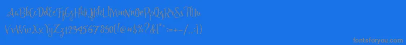 Angelia Script Free Demo-Schriftart – Graue Schriften auf blauem Hintergrund