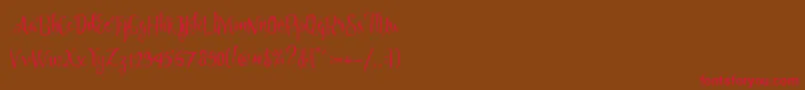 Angelia Script Free Demo-fontti – punaiset fontit ruskealla taustalla